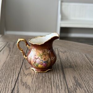 Elegant Gold and Brown Porcelain Pitcher